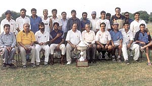 Delhi and District Cricket Association sports secretary Sunil Dev (fifth from left) with the ONGC team, which won the All-India Public Sector Cricket Tournament trophy 