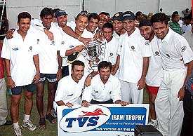 Victorious Rest of India team poses with the Irani Trophy