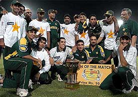 Pakistan players pose with the trophy after defeating Bangladesh by 58 runs in the fifth and final one-day international in Karachi 