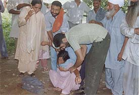 Mother of deceased Ranjit Singh being consoled by relatives at the Civil Hospital
