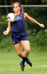 USA women's World Cup player Cat Reddick makes a stop during practice
