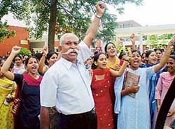 Parents and students raise slogans during a protest held outside the office of the Principal,Government College for Girls