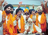 Mr Prehlad Singh Chandok, new DSGMC chief, with Mr Param Jeet Singh Sarna, former chief of DSGMC