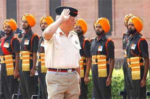 General Michael Walker, Chief of Defence Staff of Britain, inspects a guard of honour at South Block in New Delhi