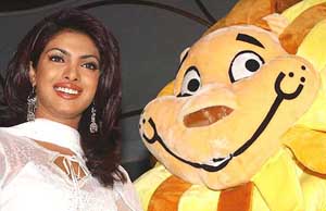 Bollywood actress and former Miss World Priyanka Chopra poses alongside the mascot of the inaugural Afro-Asian games at a function in New Delhi 