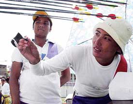 Top archers Chekrovolu of Nagaland and Dola Banerjee of Jharkhand check their shots at the 2nd National Ranking Archary Circut championship in Amritsar