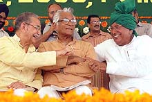 Haryana Chief Minister Om Prakash Chautala, Union Defence Minister George Fernandes and Union Minister of State for Home I.D. Swami at the ‘Samman Divas’ rally in Karnal on Thursday.
