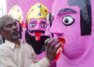 Labourers make effigies of Ravan, Kumbhakaran and Meghnad which will be torched on the eve of Dussehra festival