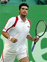 Mark Philippoussis of Australia looks towards his father after winning his second-round match against Jeff Salzenstein of the US 