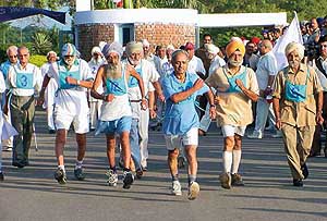 Senior citizens take part in a brisk-walk competition 