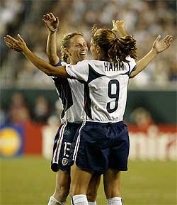 Mia Hamm and Kristine Lilly of the US celebrate their 5-0 win over Nigeria at the Women's World Cup