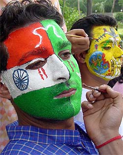 A PCTE student gets his face painted with an image of Partition