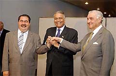 Indian Foreign Minister Yashwant Sinha with Iraqi Governing Council Foreign Minister Hoshyar Al-Zebari and senior Iraqi Governing Council member Adnan Pachachi clasp hands before their meeting at the United Nations headquarters in New York