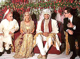 The indulgent couple � Maria Pulera from Italy graces the flower-decked dais with her Indian groom Rishi Choudhry. Flanking them are the bride�s father and brother.
