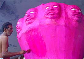 A craftsman paints Ravana at the Dresi Ground 