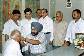 A patient being examined during a free medical check-up camp organised by Bharat Overseas Bank Limited