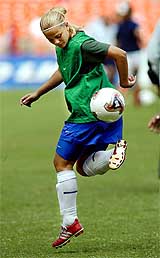 Milene Domingues, wife of Brazilian superstar Ronaldo, warms up with other members of the Brazilian women�s football team 