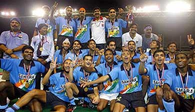 The Indian hockey team poses with medals after defeating Pakistan in the final of the sixth Asia Cup hockey tournament in Kuala Lumpur 