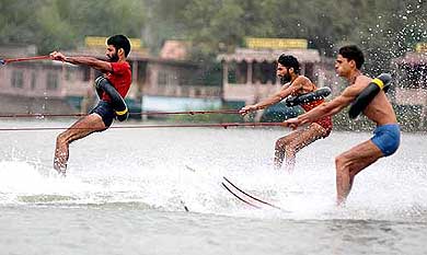 Participants in action during the graduation ceremony of a 15-day water ski course at Dal Lake in Srinagar 