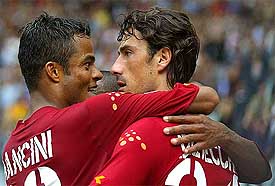 AS Roma's Marco Delvecchio celebrates his goal with Alessandro Mancini during their Serie A match against Ancona