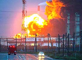 An oil storage tank in flames in Tomakomai, northern Japan