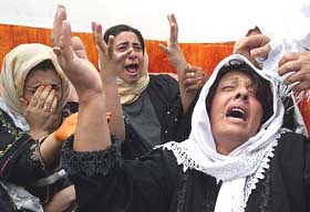Relatives of Muhammad Nassar Hamdan (22), who was killed by Israeli soldiers on Friday, mourn in his village near the West Bank city of Hebron on Sunday.