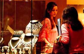 A visitor looks at jewellery at the 'Bridal Asia' exhibition in New Delhi 