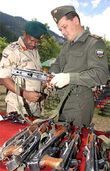 Defence attaches from Russia and Kenya, Maj Gen V. N. Chernow and Col David K. Rutto respectively, look at arms and ammunition seized from militants killed at Gurez sector along the LoC