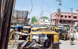 With no check on encroachments, unregulated movement of vehicles and parking of three-wheelers and mini-buses, the traffic