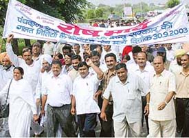 District Congress Committee members protest against �anti-people policies of the NDA government� in Panchkula on Tuesday.