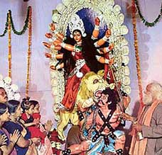 Mother Courage: Devotees stand with folded hands before the idol of Goddess Durga on the first day of Durga Puja at Banga Bhavan, Sector 35, Chandigarh, on Wednesday