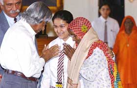 The President, Dr A.P.J. Abdul Kalam, felicitates a woman at a function to mark the International Day of the Elderly at Rashtrapati Bhavan, New Delhi, on Wednesday.