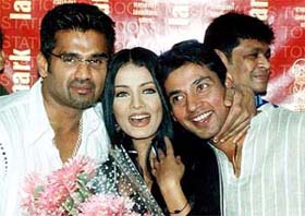 Sunil Shetty, former Miss India and actress Celina Jaitly and cricketer-turned-debutant actor Ajay Jadeja pose for a photograph