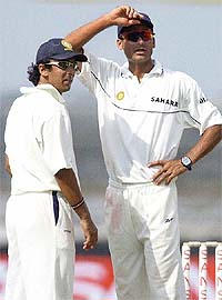 Mohammad Kaif, captain of India-A, talks with his team-mate Rohan Gavaskar