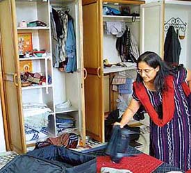 Dr Geeta Jindal sorts out the ransacked room of her house that was burgled in Sector 21, Panchkula, on Thursday night.