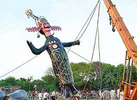 Putting the symbol of evil, Ravana, on its feet at the Sector 46 ground in Chandigarh on Friday.