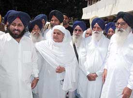 Mr Parkash Singh Badal along with Akali Dal legislators and members of Parliament comes out after a meeting with the NHRC Chairman, Justice A.S. Anand, in New Delhi on Friday.