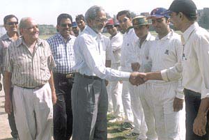 Former Test umpire Ram Babu Gupta meeting players