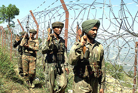 Troops patrol near the fenced Line of Control in Mendhar Sector of Jammu and Kashmir on Saturday.