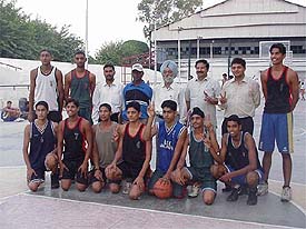 Mr Bachhitter Singh, District Education Officer (Secondary), with the Ludhiana boys� (under-17) team for the Punjab Schools Basketball Championship, in Ludhiana on Saturday