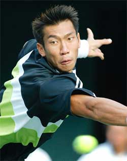 Thailand's Paradorn Srichapan reaches as he makes a return to Frenchman Sebastien Grojean