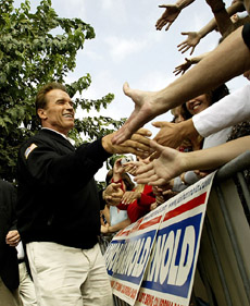 Actor and Republican gubernatorial candidate Arnold Schwarzenegger shakes hands with supporters 