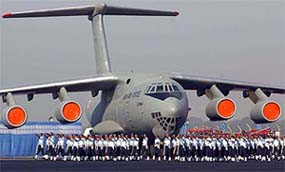 Air Force personnel march in front of an IL-76 aircraft during the rehearsal for the forthcoming Air Force Day celebrations in New Delhi
