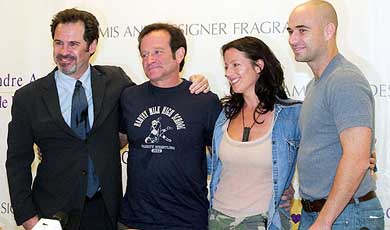 Comedians Dennis Miller and Robin Williams, singer Sarah McLachlan and tennis star Andre Agassi pose after a news conference