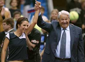 Former Russian President Boris Yeltsin lifts the hand of Anastasia Myskina of Russia after she beat Amelie Mauresmo of France