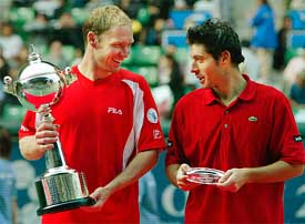 Rainer Schuettler of Germany chats with Sebastien Grosjean of France during the awarding ceremony