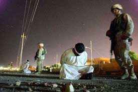 US soldiers from the 4th Infantry Division, 1st Brigade, 22nd Infantry Regiment keep guard