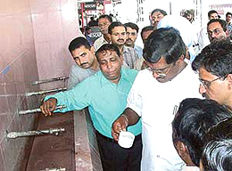 The Minister of State for Railways, Mr A.K. Moorthy, inspects the quality of drinking water at Chandigarh Railway Station on Monday.