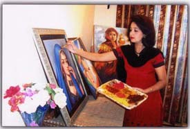Seema Ghavri gives finishing touches to one of her paintings