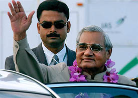 Prime Minister Atal Bihari Vajpayee waves on arrival at Bali International Airport
